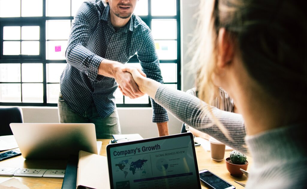 Two professionals shaking hands