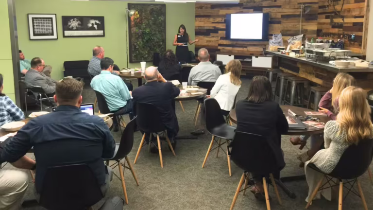 coffee area with someone leading a presentation