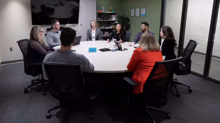 Team argues at conference table