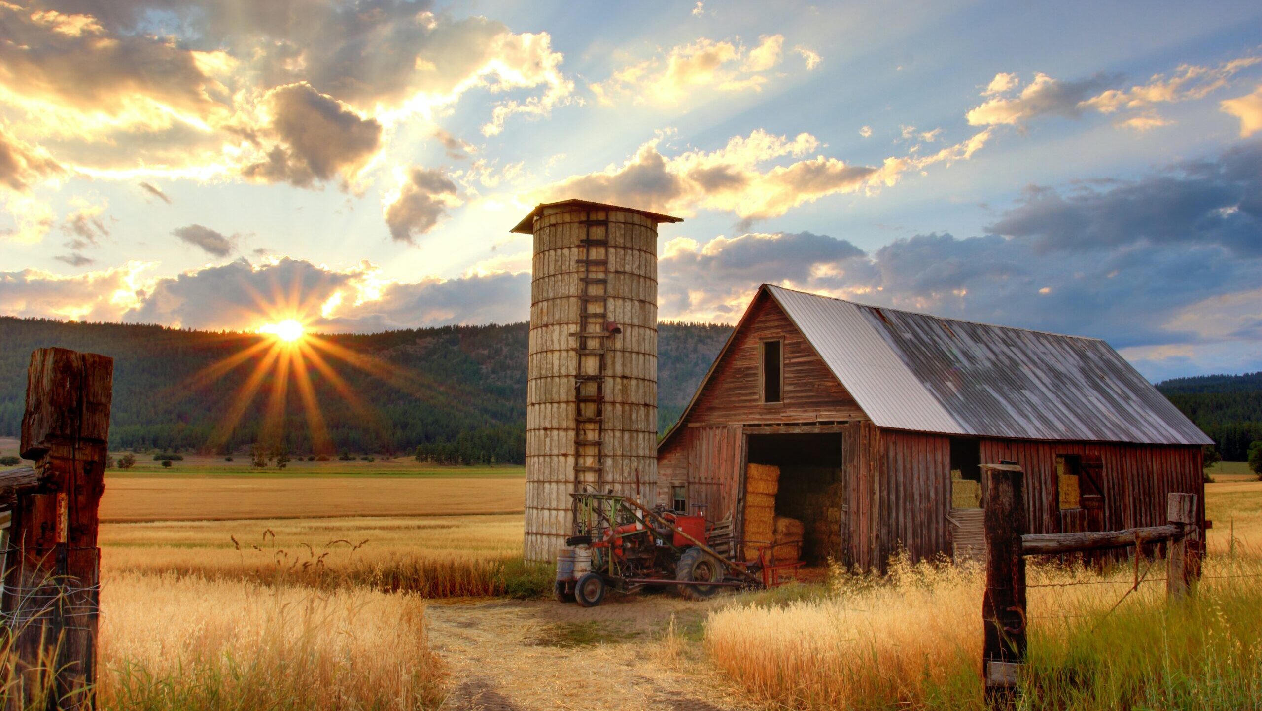 Farm with sun setting.