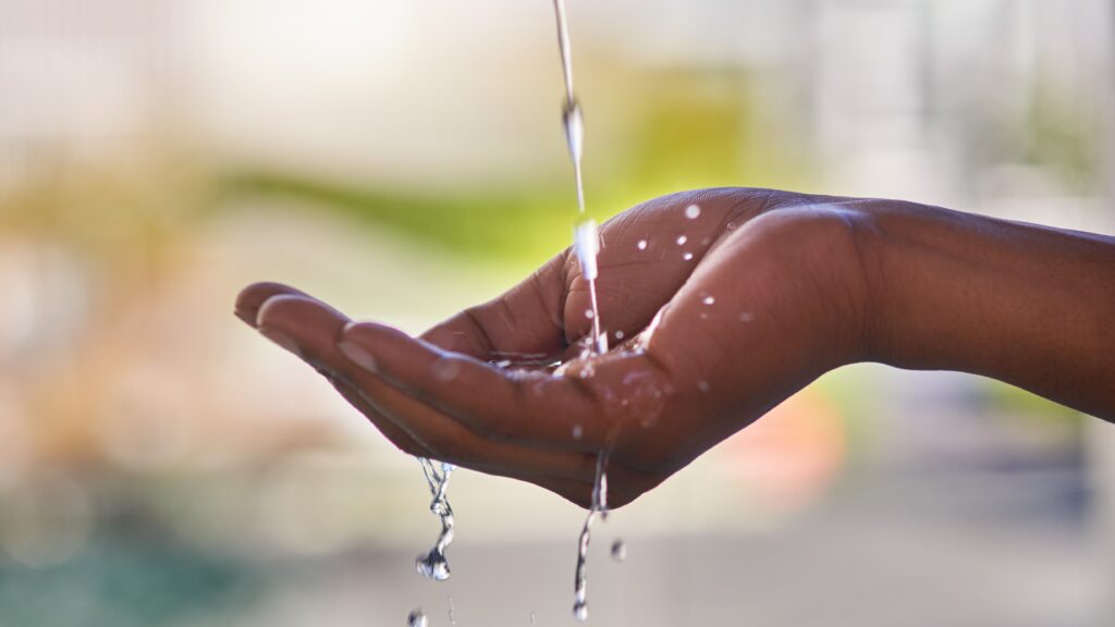 water running in hand and overflowing