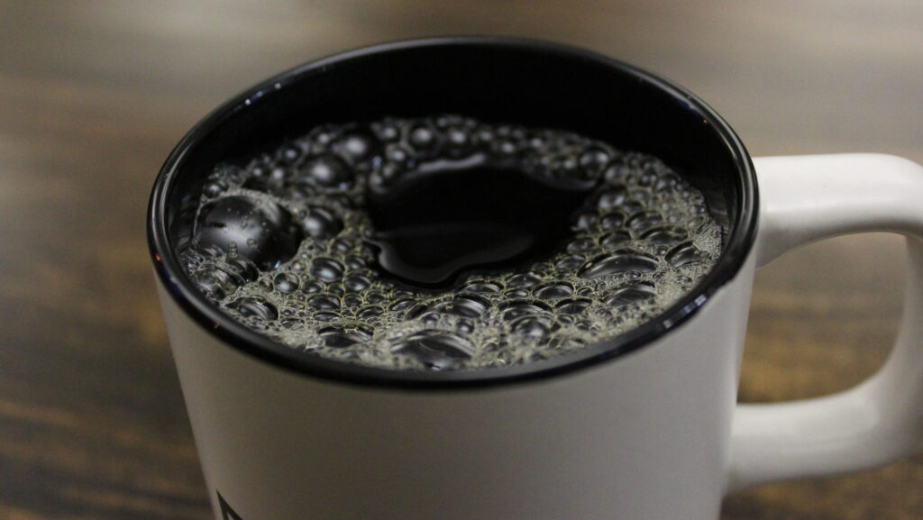 Hot coffee in mug.