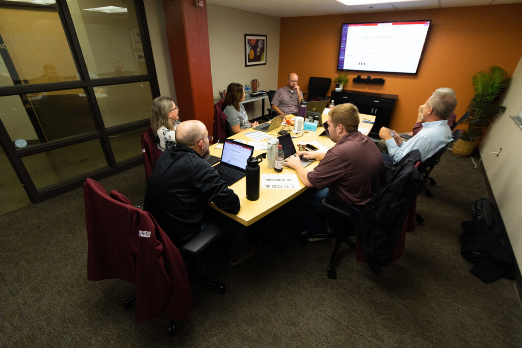 People sit in conference room