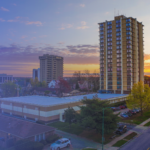 Picture of Sunvilla Tower on the Missouri State University campus with downtown Springfield, Missouri in the background.