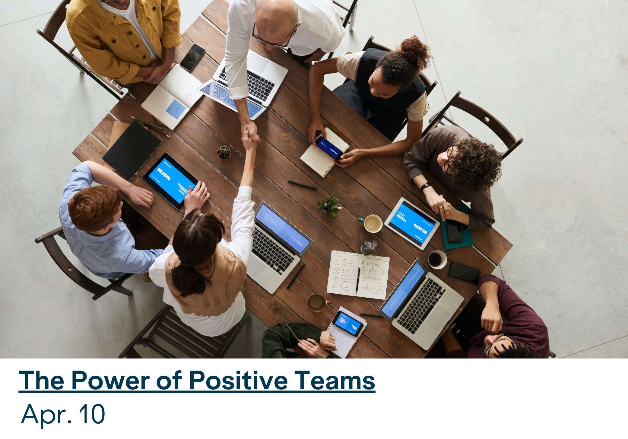 a team sits around a table for a business meeting