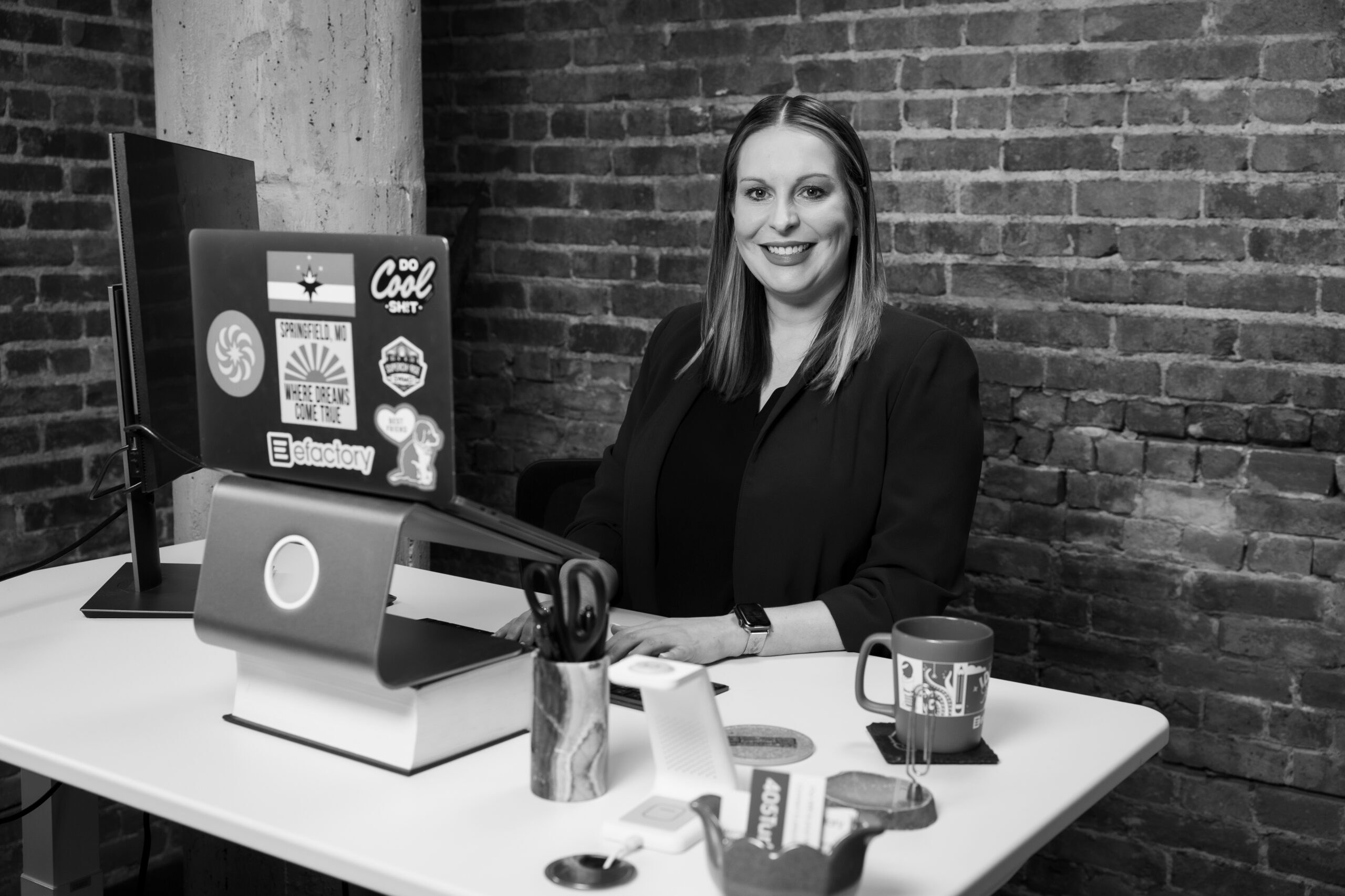Rachel Anderson smiles at her desk.