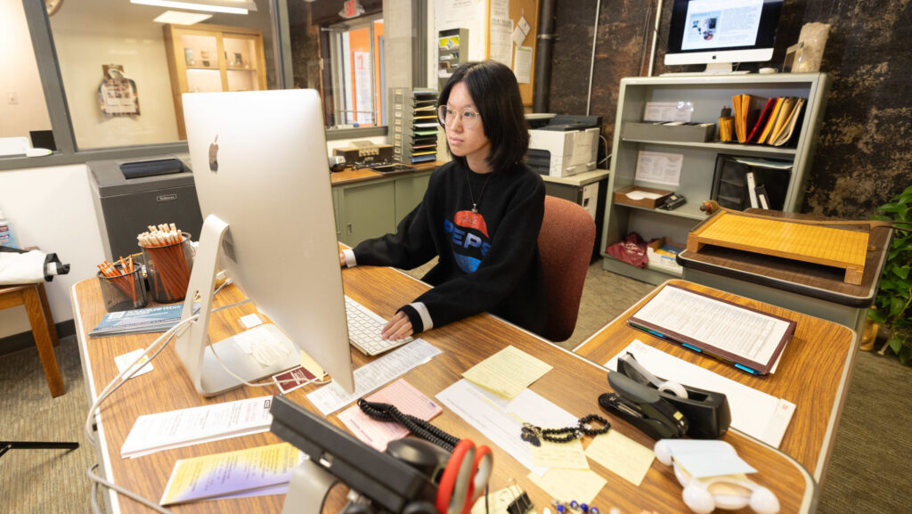 Student working at desk.