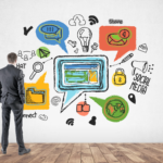 Business man in a suit looking at a wall of illustrations of social media, ideas, magnifying glass, do-to lists, a globe, etc.
