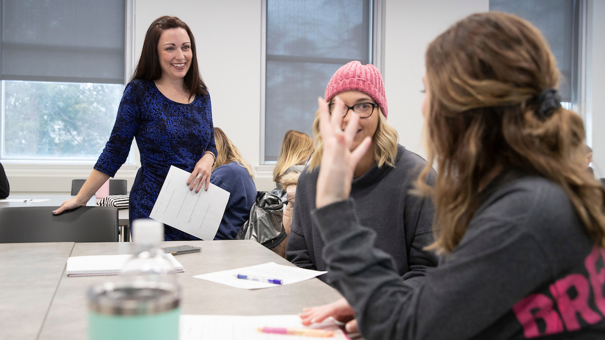 Students connecting with professor