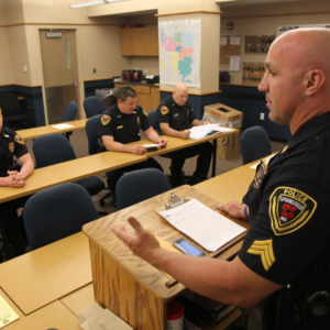 Room full of Springfield Police officers with one speaking at podium