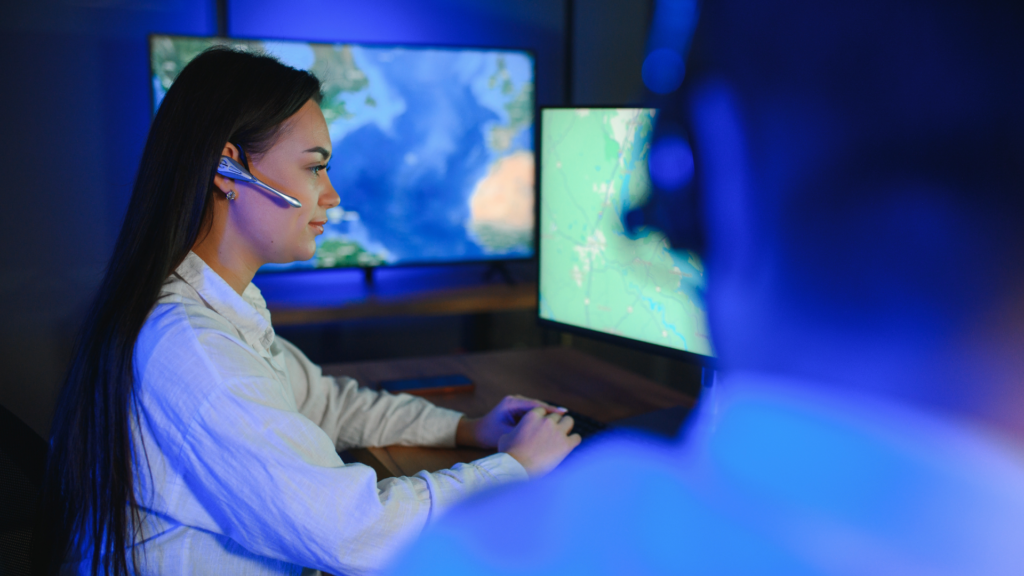 Dispatch officer typing on computer