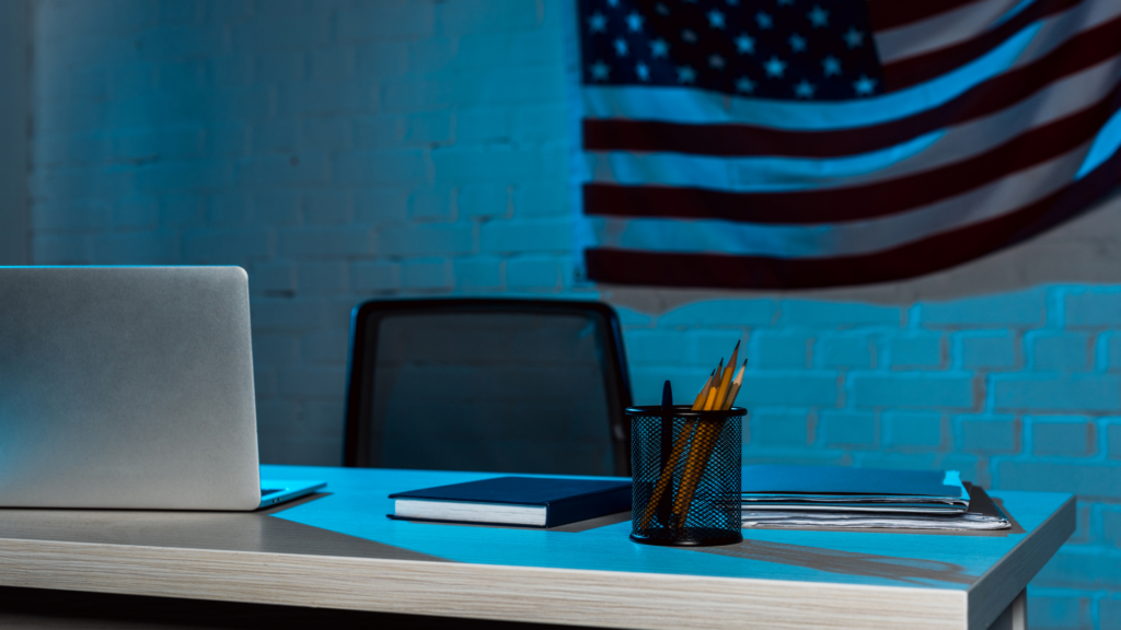 Dark office with American flag on the wall