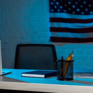 Dark office with American flag on the wall