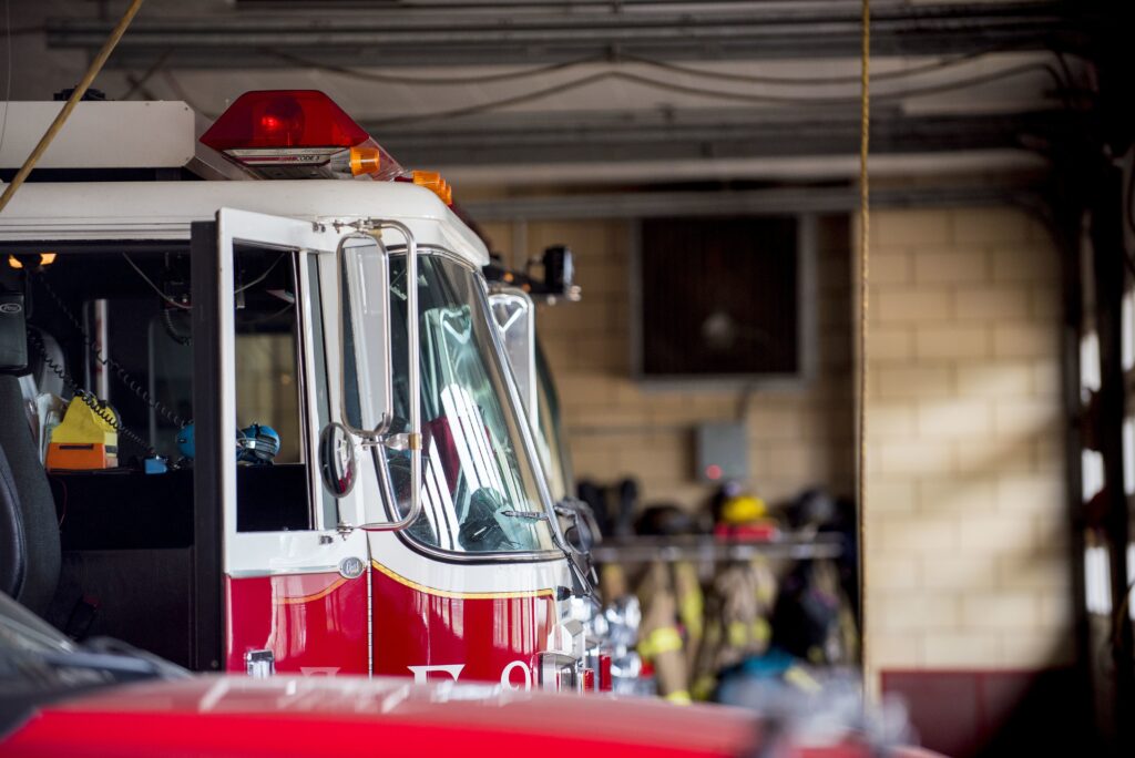 Closeup shot of a firetruck with an open door and a blurred background