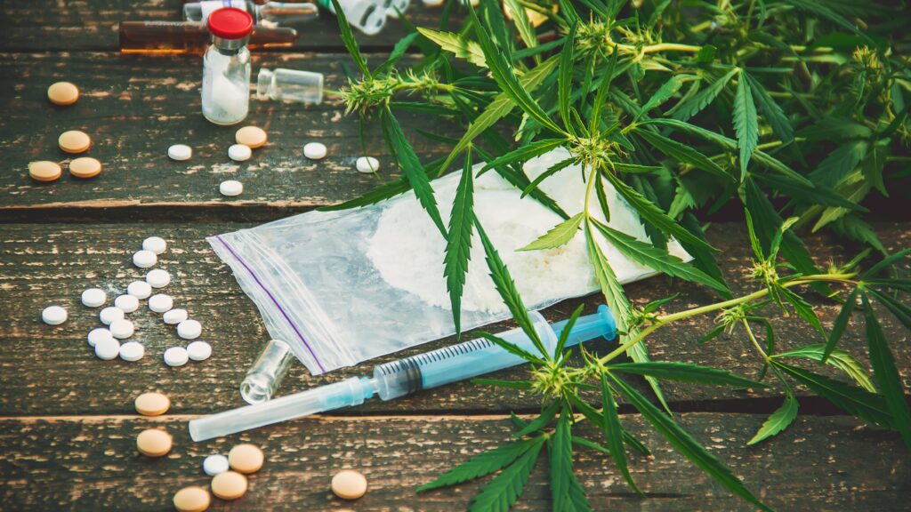 assorted drugs laying on table