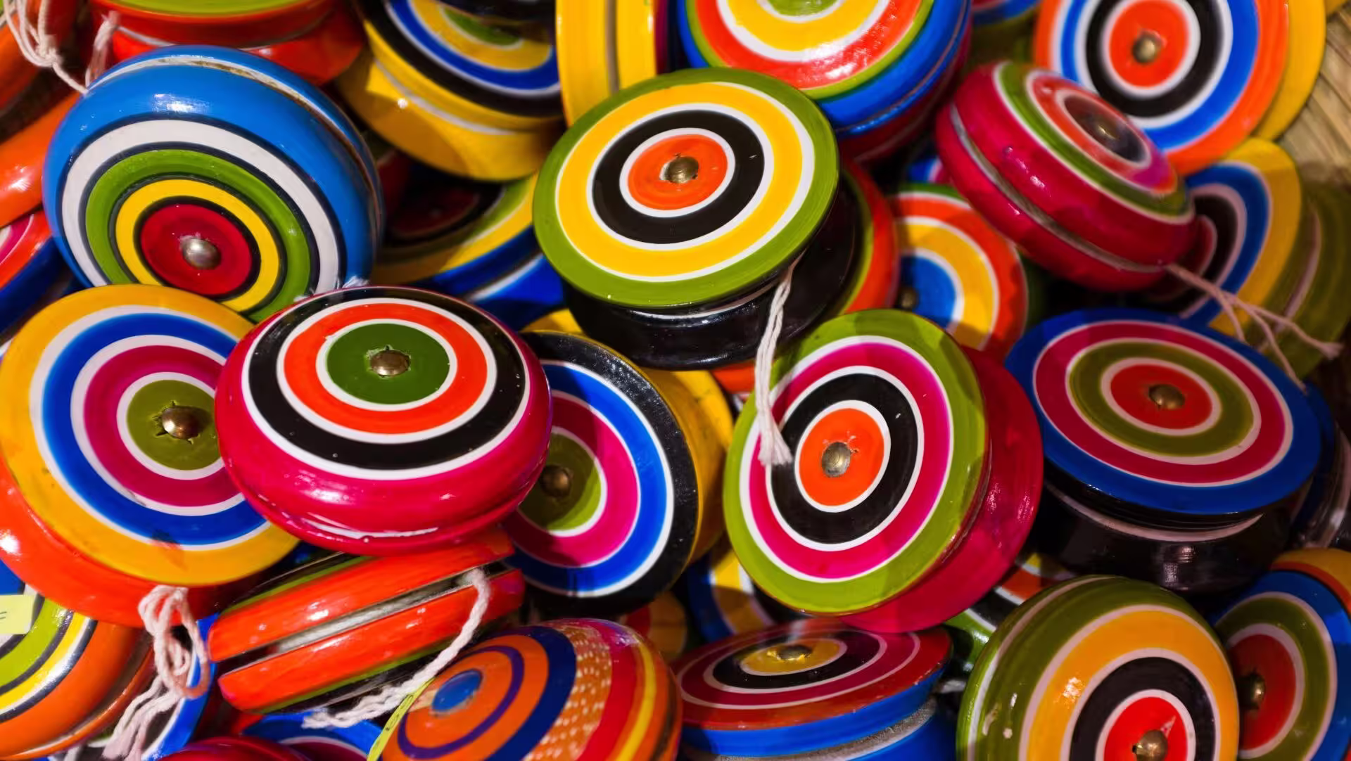 Pile of brightly colored yo-yos