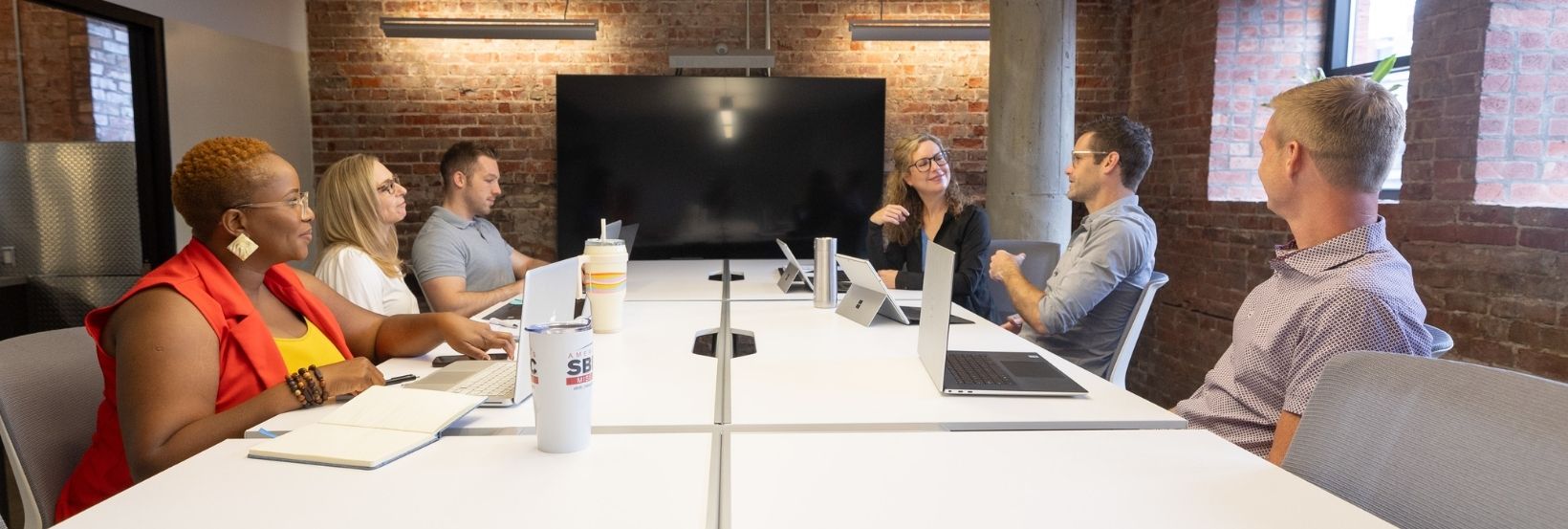 group gathered around conference table