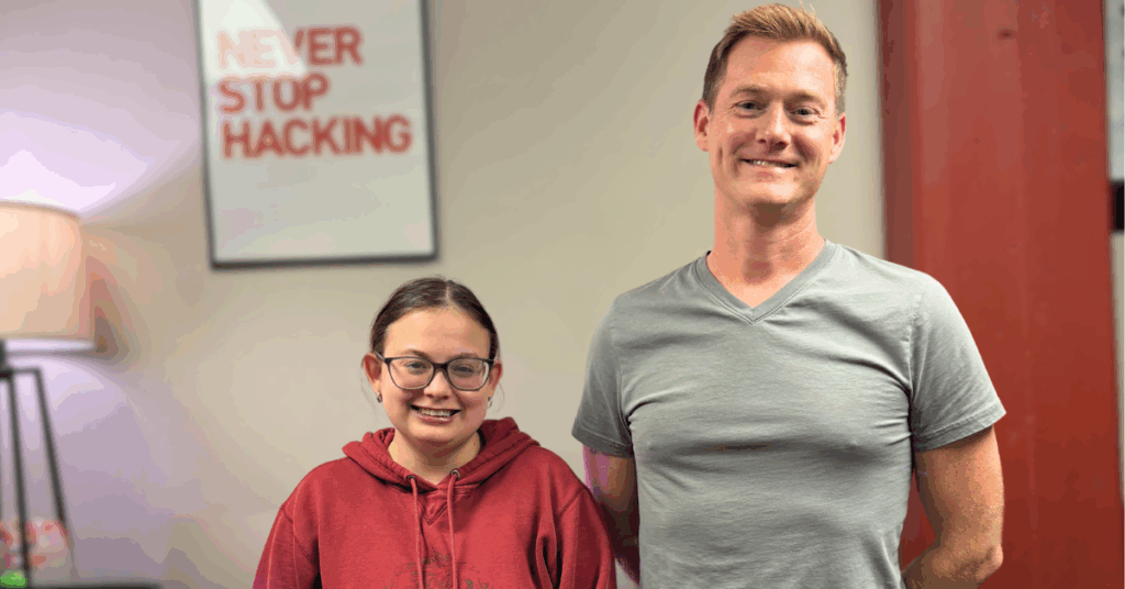 Chad and Elise pose in office