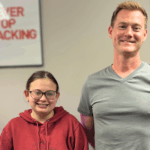 Chad and Elise pose in office