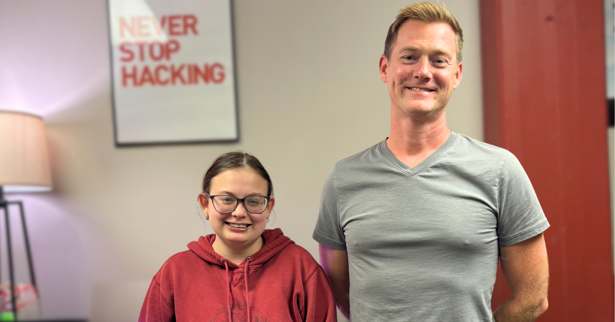 Chad and Elise pose in office